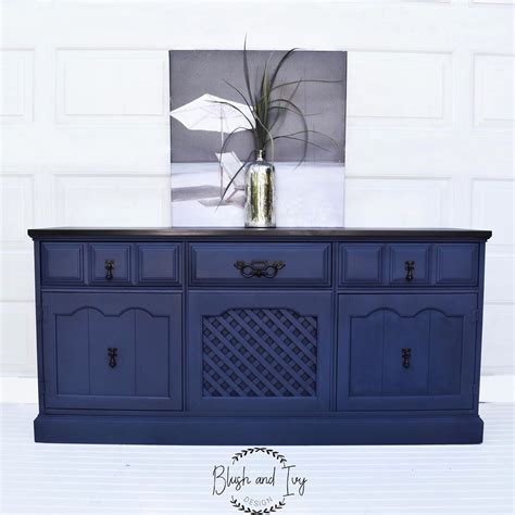 Use it on the walls when you want to go dark but not quite black. Buffet painted in chalk paint. dark navy with a dark brown ...