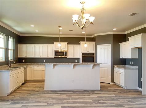 Hampton bay hampton satin white raised panel stock assembled wall bridge kitchen cabinet (30 in. As seen in The Mercedes plan by Permian Homes - white raised panel cabinets, white pearl granite ...
