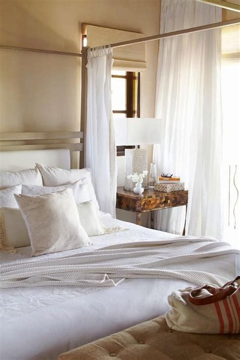 Canopy beds, which have been long considered a sign of luxury, which were carved and decorated the most expensive ways possible, stopped being not for all and now this is affordable. Chic bedroom features a metal canopy bed fitted with sheer ...