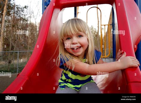 Young Girl On Slide Stock Photo Alamy