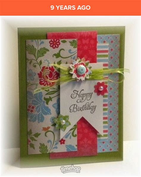 a birthday card with flowers and ribbons on it