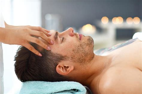 Handsome Man Having Massage In Spa Salon Stock Image Image Of Towel
