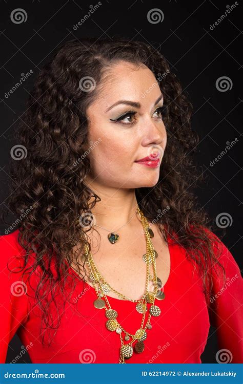 Beautiful Brunette In The Form Of A Gypsy On A Dark Background Stock