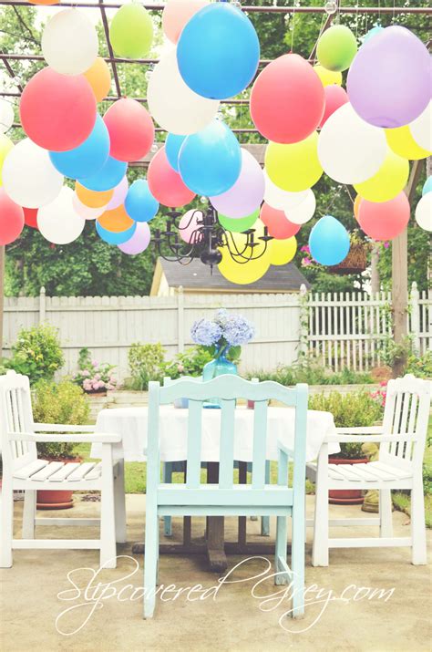 Looking for 75th birthday party decorations that are sure to wow? Outdoor Movie Birthday Celebration - Slipcovered Grey