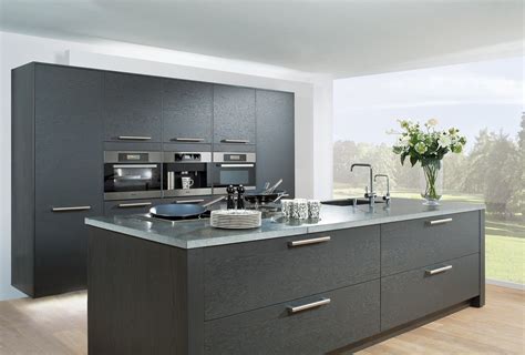 The transitional kitchen's masterpiece is the gorgeous hood with a great island! Image result for grey oak cabinets kitchen | Keukens ...