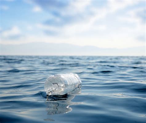 Plastic Bottle Floating In The Ocean Stock Photo Image Of Ecosystem