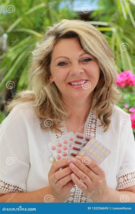 mature woman holding pills in her hand stock image image of menopause climacterium 132256695