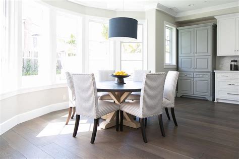Close up of a suburban round bay window featuring stained glass from an english city. Bay Window Dining Table - Transitional - Kitchen