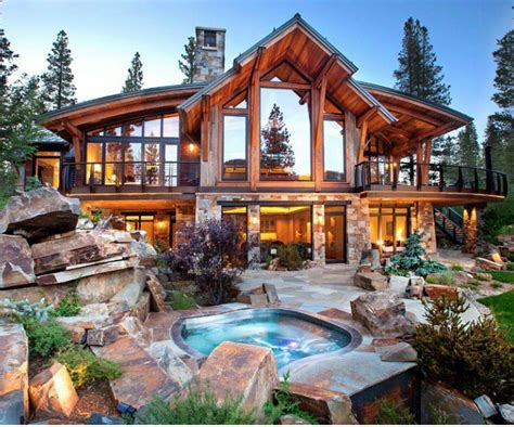 A Large House With A Hot Tub In Front Of It