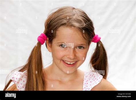 Portrait Of A 7 Year Old Girl With A Bright Background Stock Photo Alamy