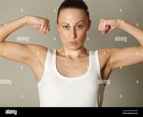 Female Model Flexing Her Biceps Stock Photo Alamy