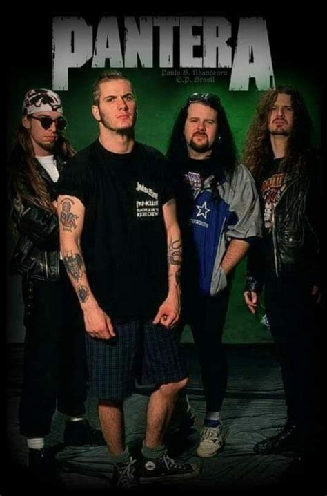 the band pantera posing in front of a green background