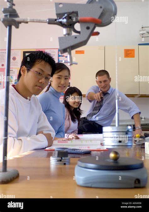 Science Class Students And Teacher In Physics Classroom With Gravity