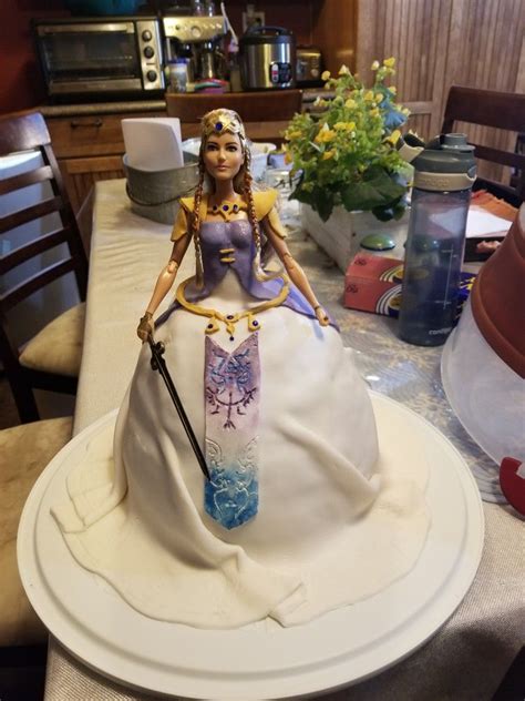 Let her dream doll and character be one of her. Princess Zelda doll cake I made with a Hippolyta Barbie doll. | Zelda cake, Doll cake, Cake