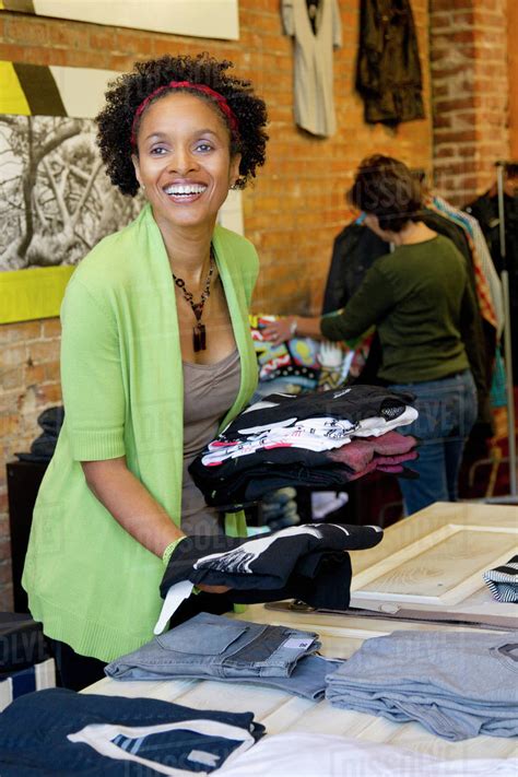 African American Small Business Owner In Clothing Shop Stock Photo