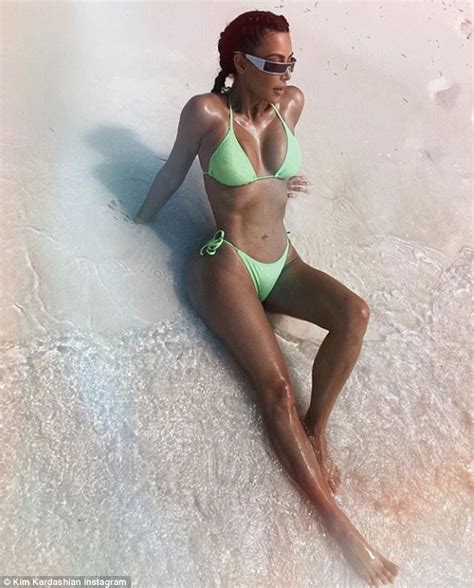 kim kardashian shows off tiny waist in a neon green bikini daily mail online