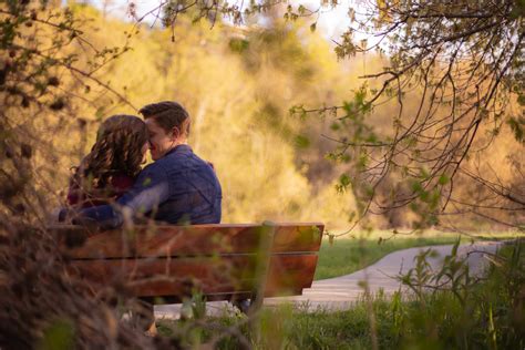 Photography Of Couple Sitting On Bench · Free Stock Photo