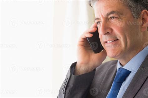 Thoughtful Man Calling Someone With His Mobile Phone 1142743 Stock