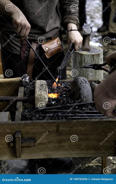 Blacksmith Heating Up A Pice Of Steel Stock Photo Image Of Pliers