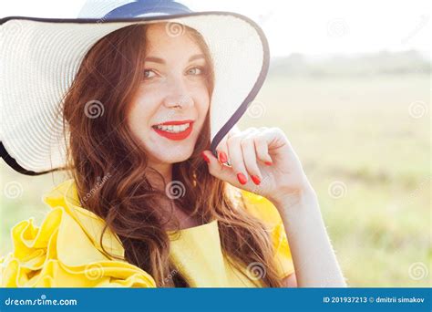 Beautiful Woman In Yellow Dress In Hat With Fields Portrait Stock Image