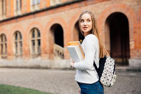 Smart Female College Student With Bag And Books On Campus Outdoors
