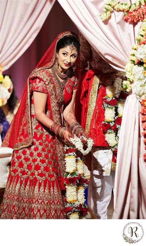 indian bride offering garland indian and south asian indian destination wedding photographers