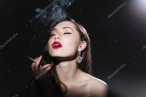 Beautiful Woman Smoking Cigarette — Stock Photo © Vadymvdrobot 103982824