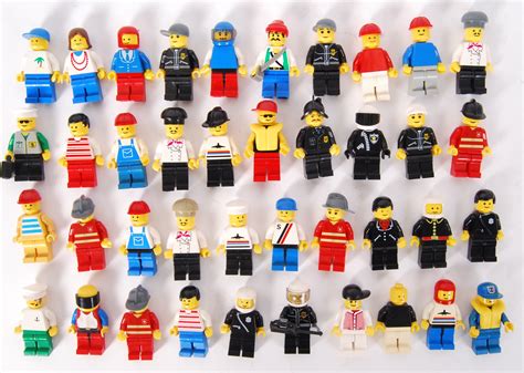 a collection of 40x vintage lego minifigures to include some with sticker fronts system city