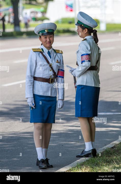 North Korean Traffic Security Officers In White Uniforms In The Street
