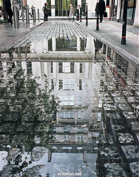 Buildings Reflected In Water