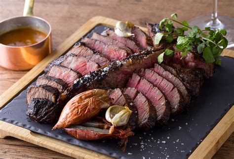 A mammoth steak taken from the whole sirloin, this cut is the best of both worlds. The Mighty T-Bone Steak verliest terrein - fooddrunk