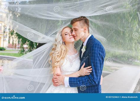 Wedding Bride And Groom Kissing At A Beautiful Park On The Wedding Day Romantic Married
