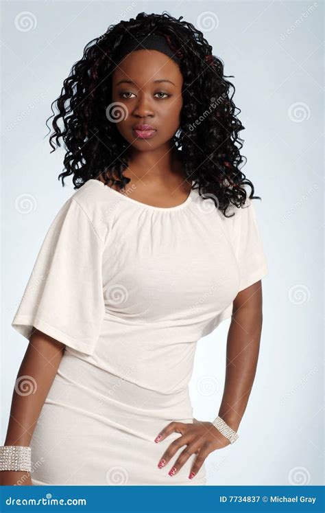 Young Jamaican Woman Wearing A White Dress Royalty Free Stock