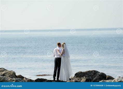 Happy Bride And Groom On The Ocean Coast Stock Photo Image Of Bouquet