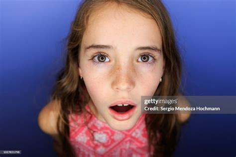 Young Girl Looking At The Camera Surprised High Res Stock Photo Getty