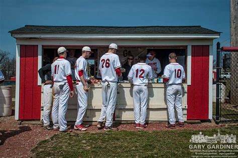 Baseball Players Line Up At Concession Stand For Hot Dogs Highschool