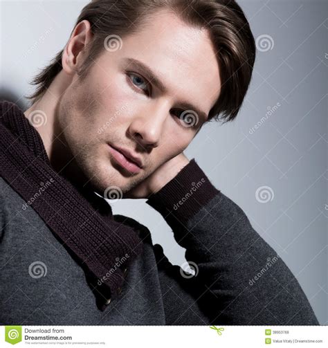 Portrait Of Sexy Young Man With Hand Near Face Stock