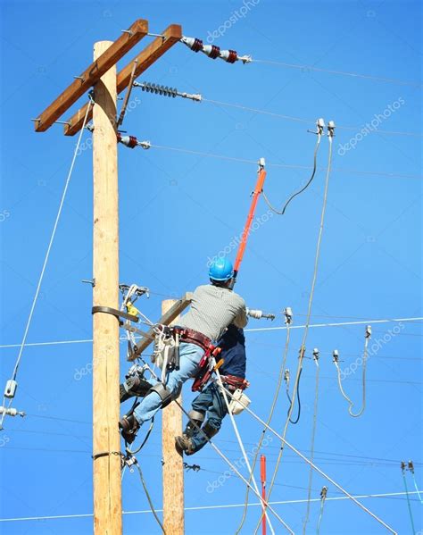 Electrical Lineman Working Stock Photo By ©graphicphoto 61016065