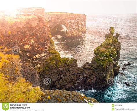 Londrangar Rock Lava Formation In The Sea Eroded Basalt Cliffs In The