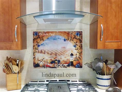 The rest of the backsplash tile is a tumbled marble noce from lowe's. Italian tile murals - Tuscany Backsplash tiles