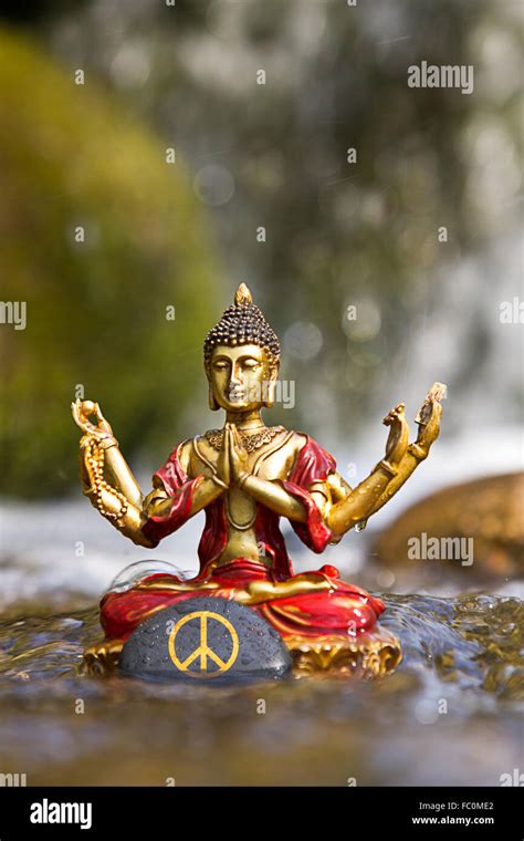 Buddha Statue With The Peace Sign Stock Photo Alamy