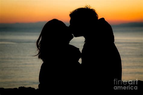 Romantic Couple Silhouettes Kissing With Sunset Photograph By Gioele