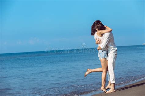 Romance On Vacation Couple In Love On The Beach Flirting Stock Image