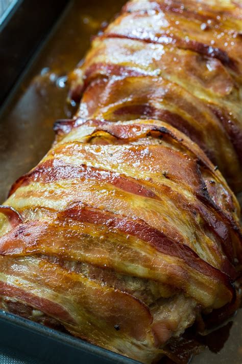 This bacon wrapped pork loin is cooked on the grill, which means you have plenty of room in your oven for side dishes, desserts and more. Bacon Wrapped Maple Glazed Pork Loin - Spicy Southern Kitchen