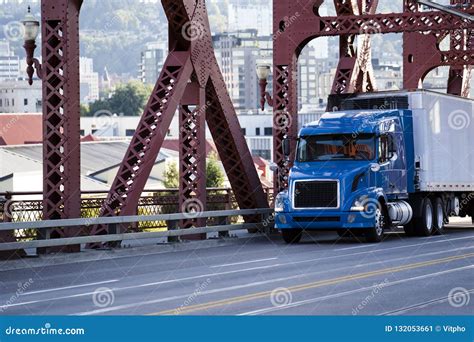 Day Cab Blue Big Rig Semi Truck Transporting Commercial Cargo In