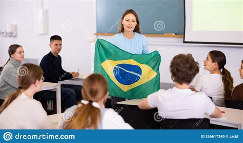 Female Teacher Shows Students Flag Of Brazil Stock Photo Image Of