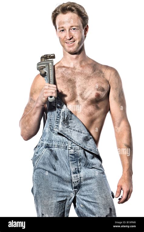 Sexy Greasy Caucasian Man 30 Something Handyman Plumber With His Tools Wrench Wearing Bib Jeans