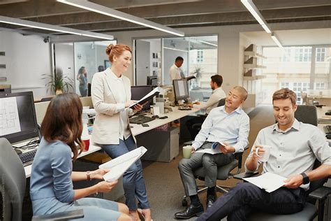 Simply click schedule meeting to set a. Casual team meeting in open office discussing business by ...