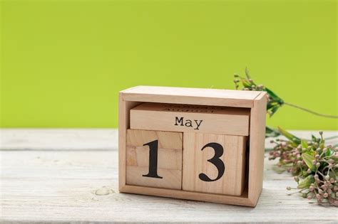 Premium Photo Cube Calendar For May 13th On Wood