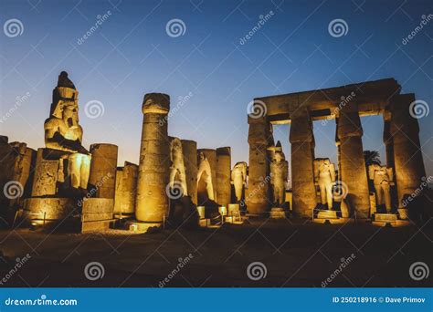 Ancient Egyptian Ruins Of God Statues Near The Pylon Of Luxor Temple